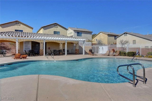 view of swimming pool featuring a patio area and a pergola