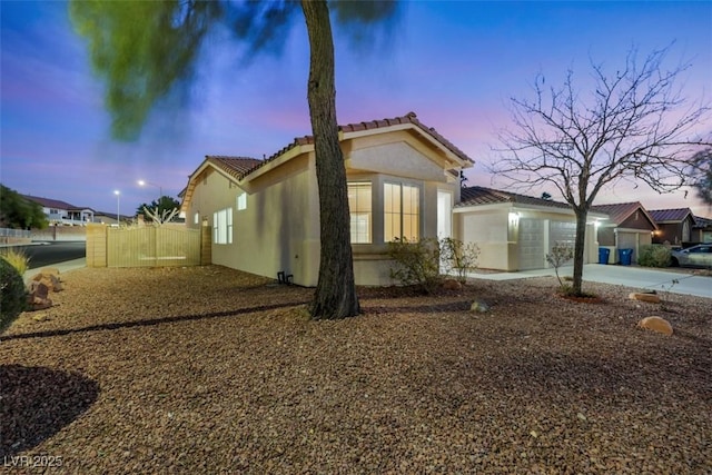 view of property exterior at dusk