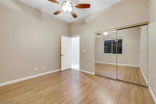 unfurnished bedroom with a closet, ceiling fan, and light wood-type flooring