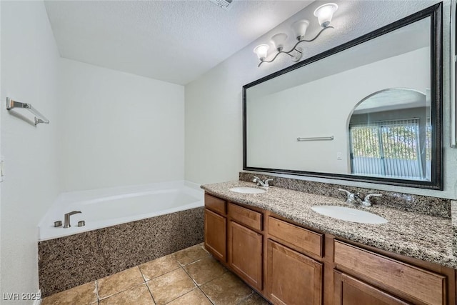 bathroom with double vanity, a garden tub, a sink, and tile patterned floors