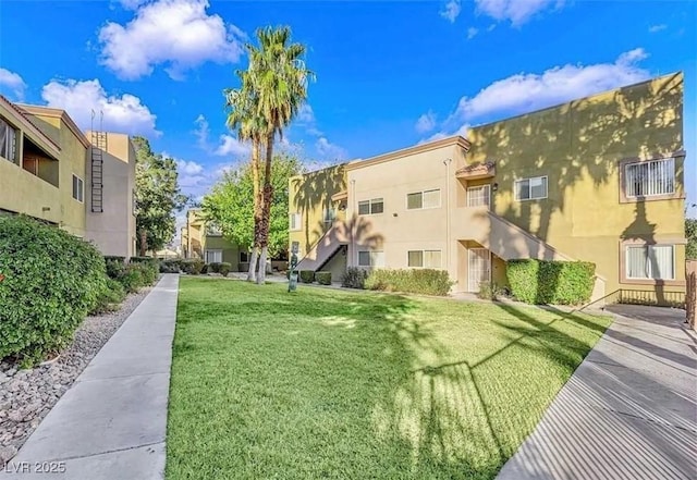 view of home's community with a residential view and a yard