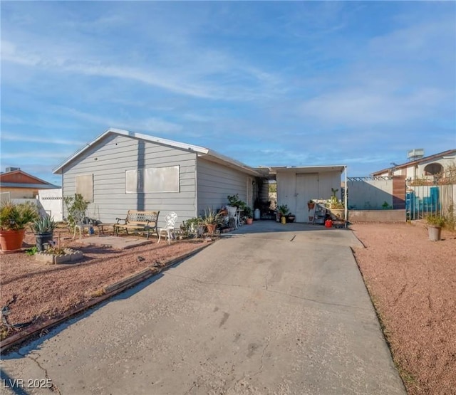 view of front of home featuring fence