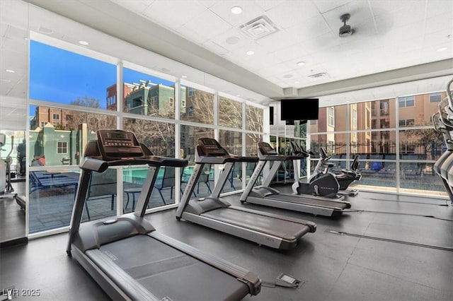 exercise room featuring expansive windows