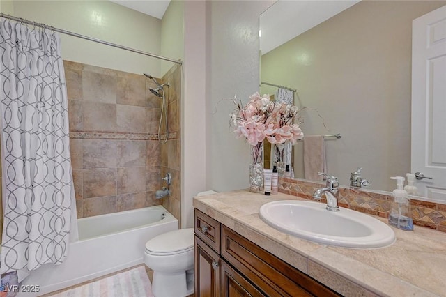 full bathroom featuring shower / tub combo with curtain, vanity, and toilet