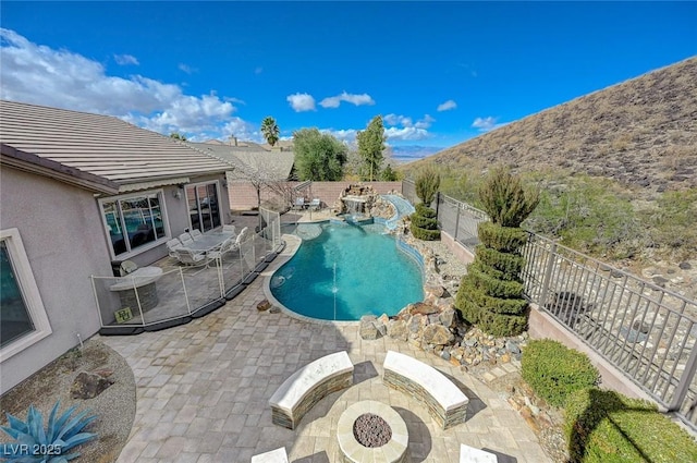 view of swimming pool featuring a patio, a mountain view, and central air condition unit