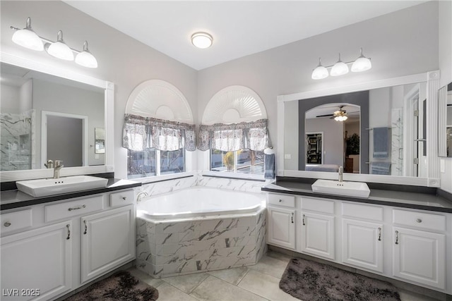 bathroom with vanity, tile patterned flooring, independent shower and bath, and ceiling fan