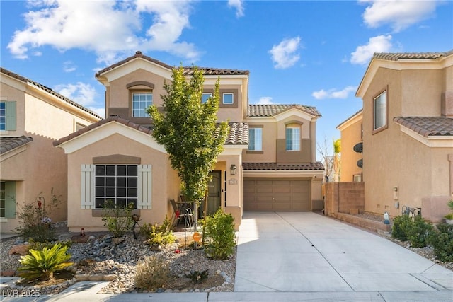 mediterranean / spanish-style house with a garage