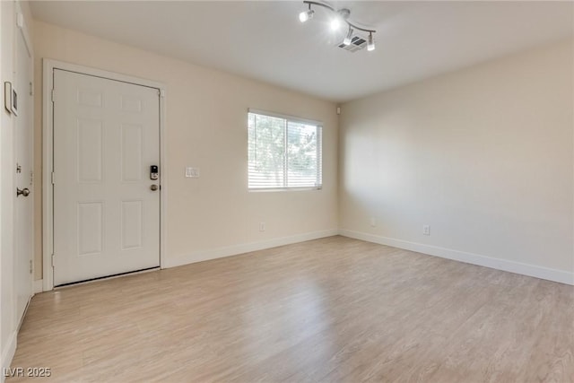 foyer with light hardwood / wood-style floors