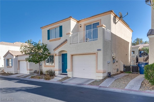 view of front of home with a garage and a balcony