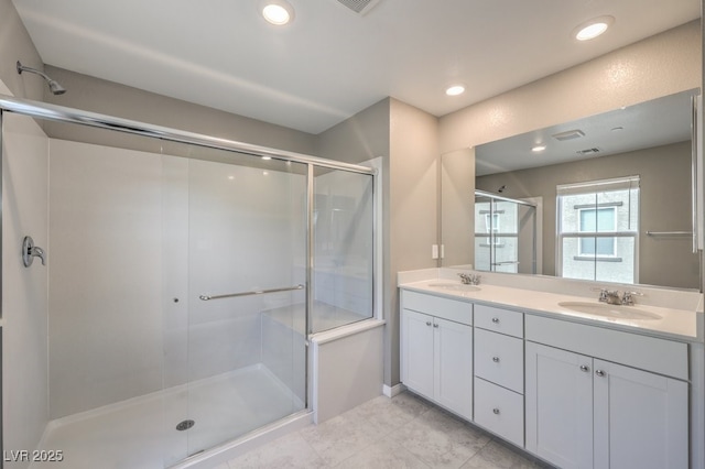 full bath featuring recessed lighting, visible vents, a sink, and double vanity