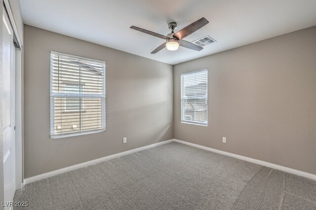 unfurnished room with carpet floors and ceiling fan