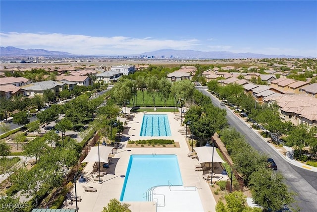 drone / aerial view with a residential view and a mountain view