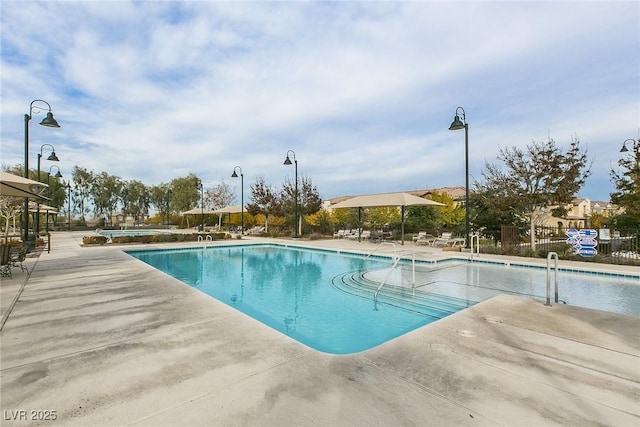 view of swimming pool featuring a patio area