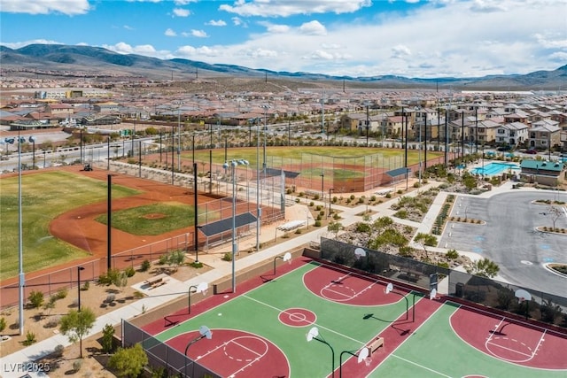 birds eye view of property featuring a mountain view