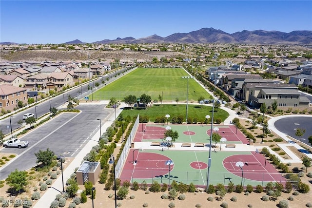 birds eye view of property with a mountain view