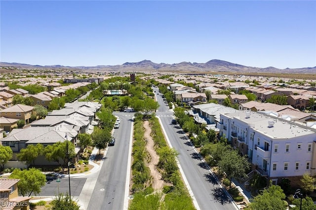 birds eye view of property with a mountain view