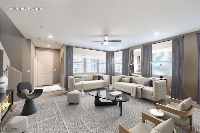 living area featuring a ceiling fan and recessed lighting