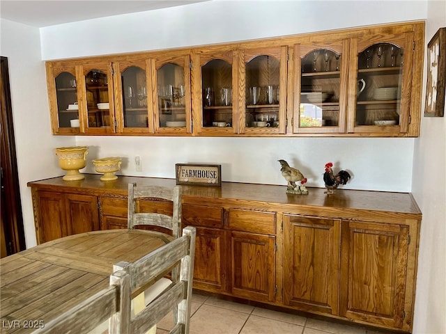 bar featuring light tile patterned flooring