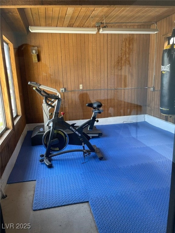 workout area with wood walls and wood ceiling