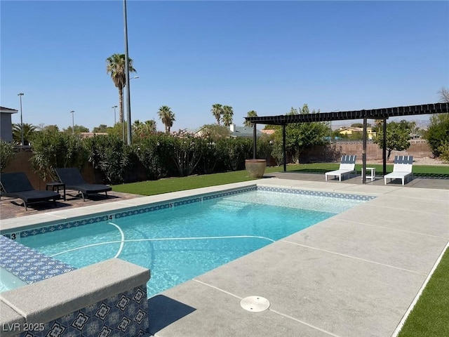 pool with fence and a patio