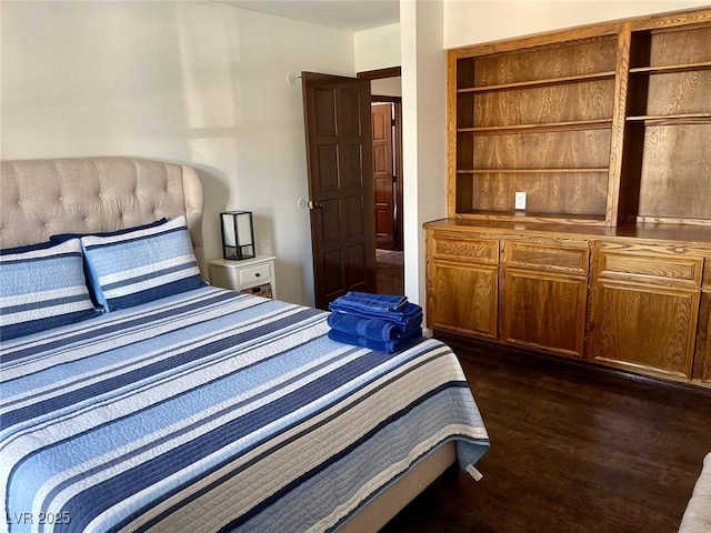 bedroom featuring dark wood-style flooring