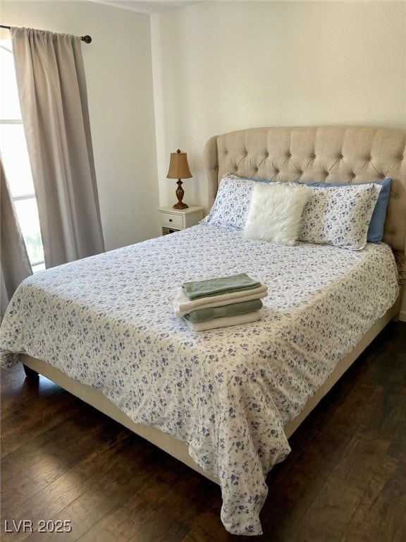 bedroom featuring dark wood-style floors