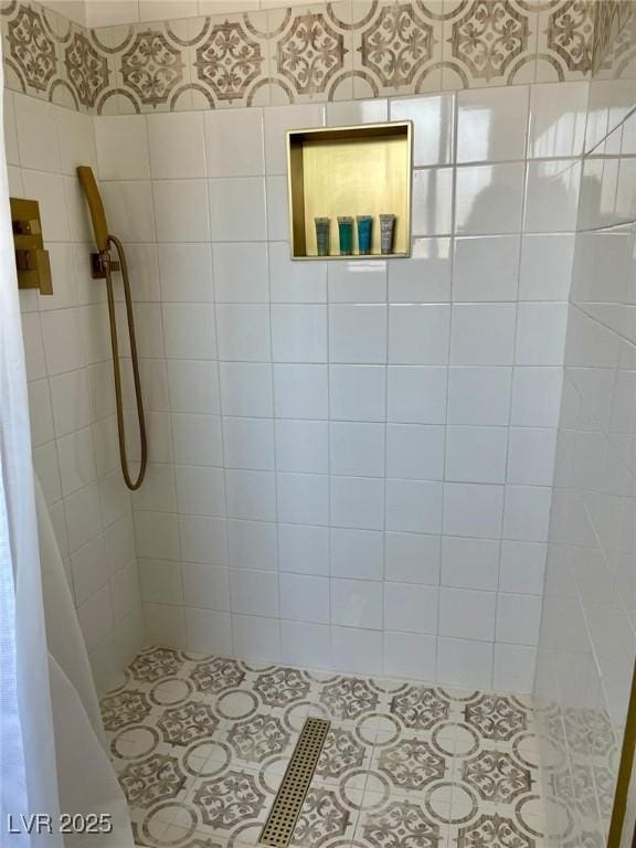 full bathroom with a shower stall and wallpapered walls