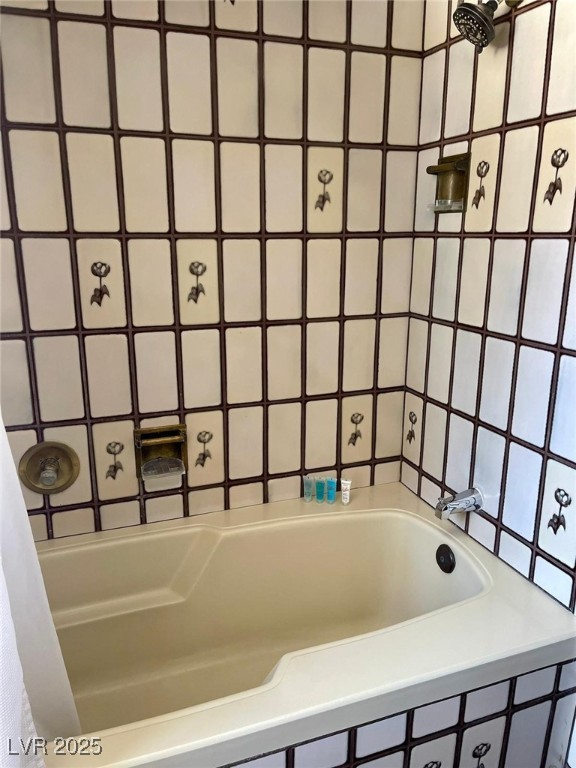 bathroom with a tub to relax in and curtained shower