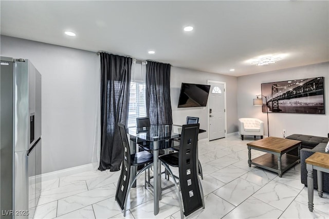dining area with baseboards, marble finish floor, and recessed lighting