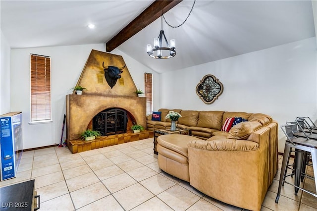 living area with vaulted ceiling with beams, a large fireplace, a chandelier, and light tile patterned floors