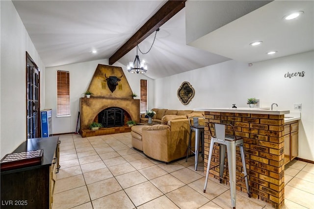 living room featuring recessed lighting, a fireplace, vaulted ceiling with beams, light tile patterned floors, and a chandelier