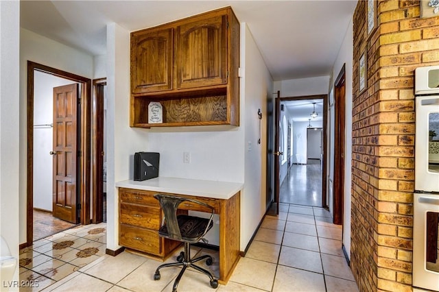 hall with light tile patterned floors