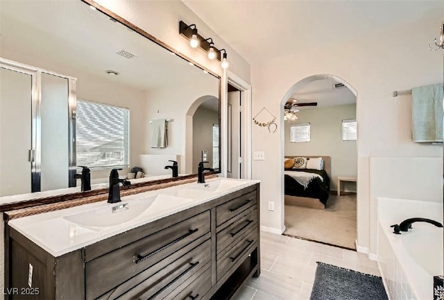 bathroom featuring ceiling fan, vanity, tile patterned floors, and plenty of natural light