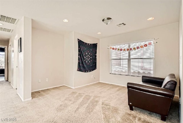 sitting room with light carpet