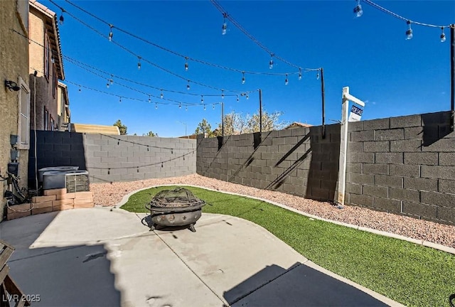 view of patio / terrace featuring an outdoor fire pit