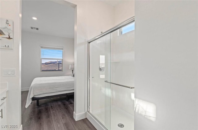 bathroom featuring a shower stall, visible vents, and a wealth of natural light