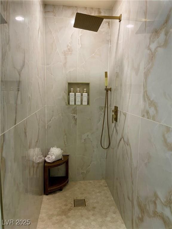 bathroom featuring a marble finish shower and visible vents