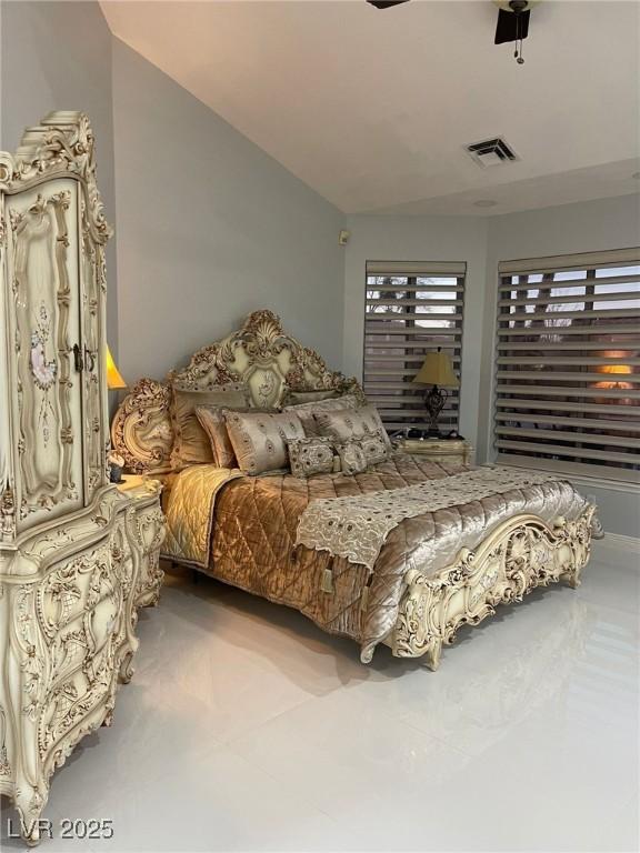 bedroom with visible vents and a ceiling fan