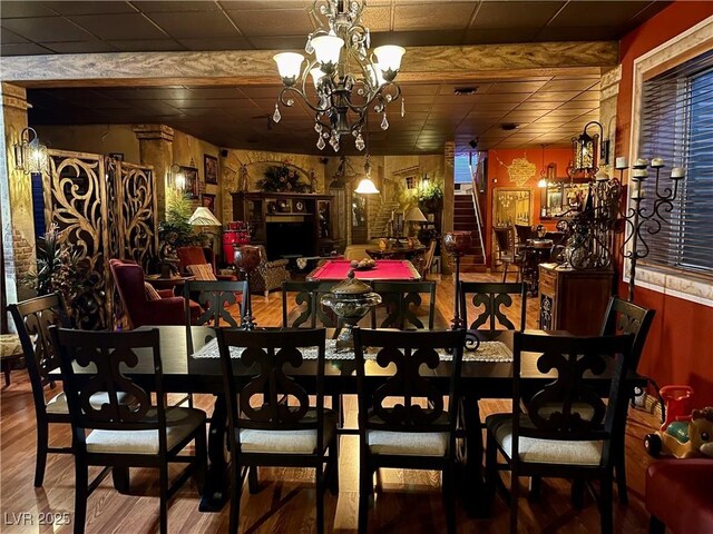 dining room with an inviting chandelier and wood finished floors