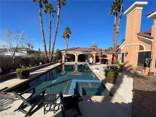 view of swimming pool featuring a fenced in pool, fence, a patio, and a gazebo