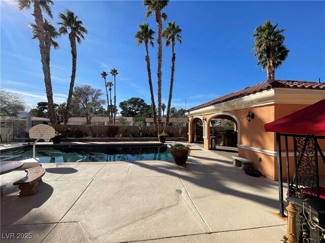 view of swimming pool featuring a fenced in pool, a patio area, and a fenced backyard