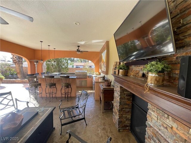 view of patio with outdoor wet bar, grilling area, and area for grilling