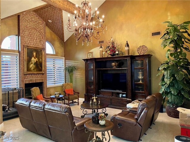 living area with high vaulted ceiling, a fireplace, and visible vents