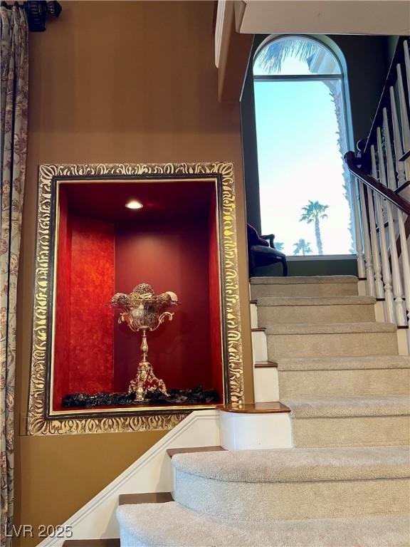 staircase with a wealth of natural light