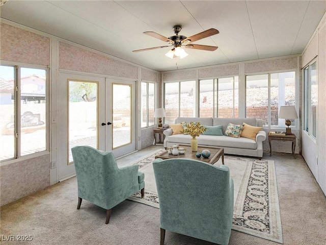 sunroom / solarium featuring ceiling fan and plenty of natural light