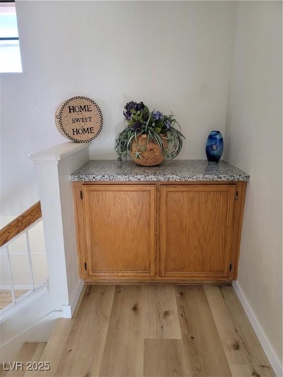 interior details featuring hardwood / wood-style flooring