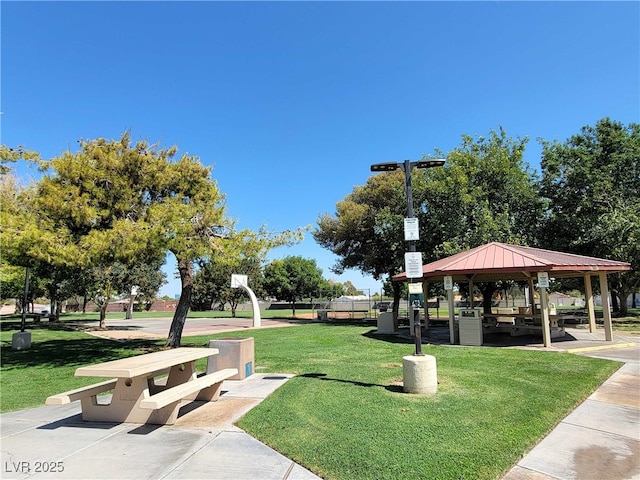 surrounding community with a lawn and a gazebo