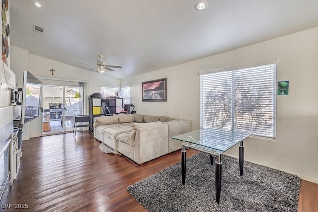 living room with vaulted ceiling, dark wood-type flooring, and ceiling fan