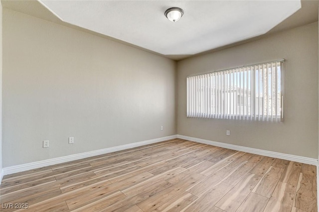 unfurnished room featuring light wood-type flooring