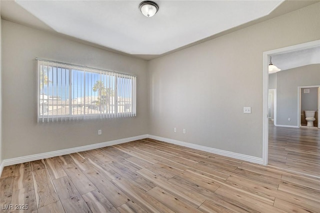 unfurnished room with light hardwood / wood-style flooring